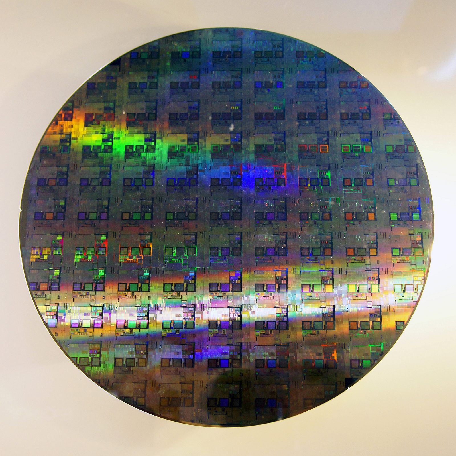 A 12-inch silicon wafer patterned with integrated-circuit dies.
