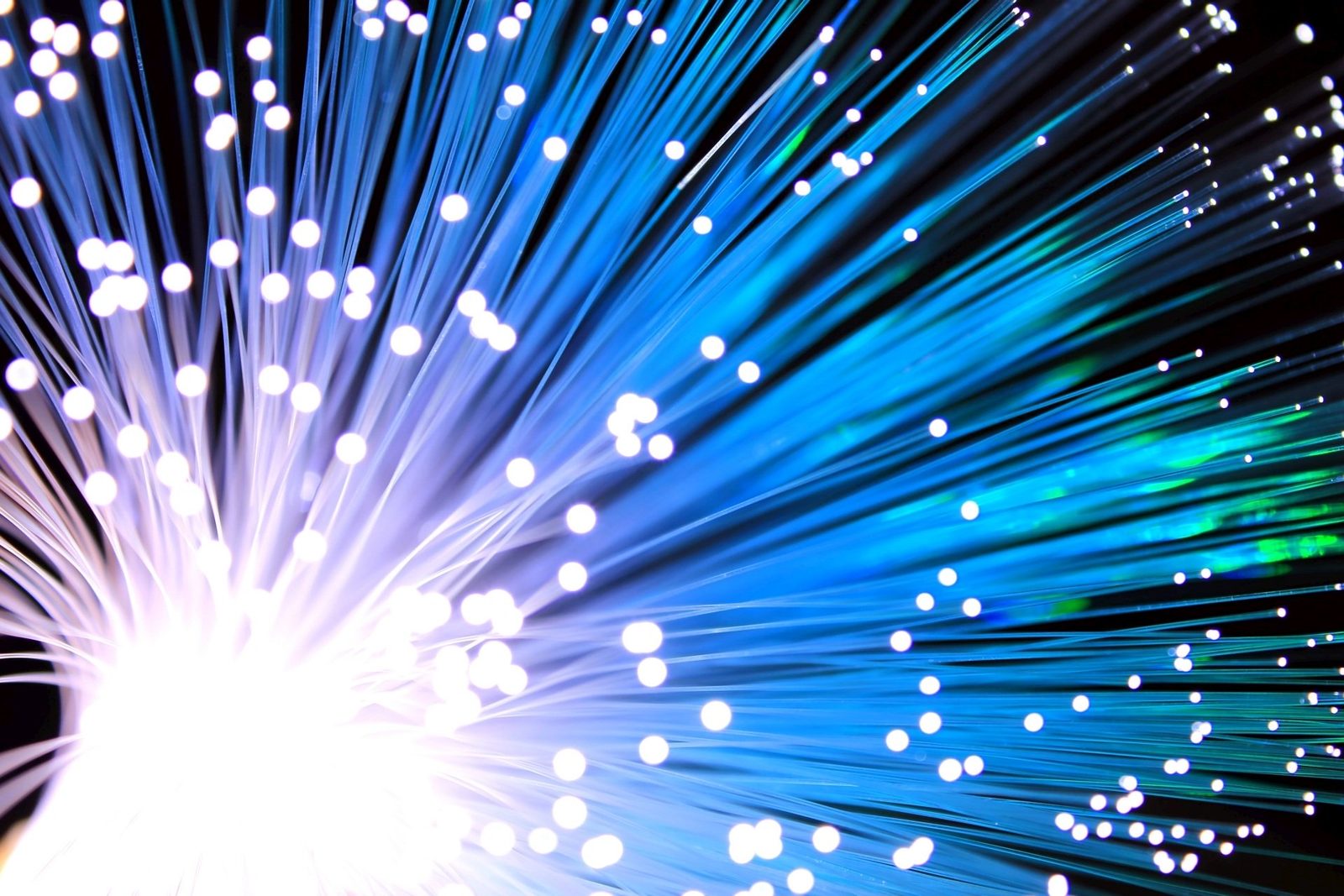 The AI cluster's next bottleneck isn't the chip. It's the wire between the chips, and copper is out of room.