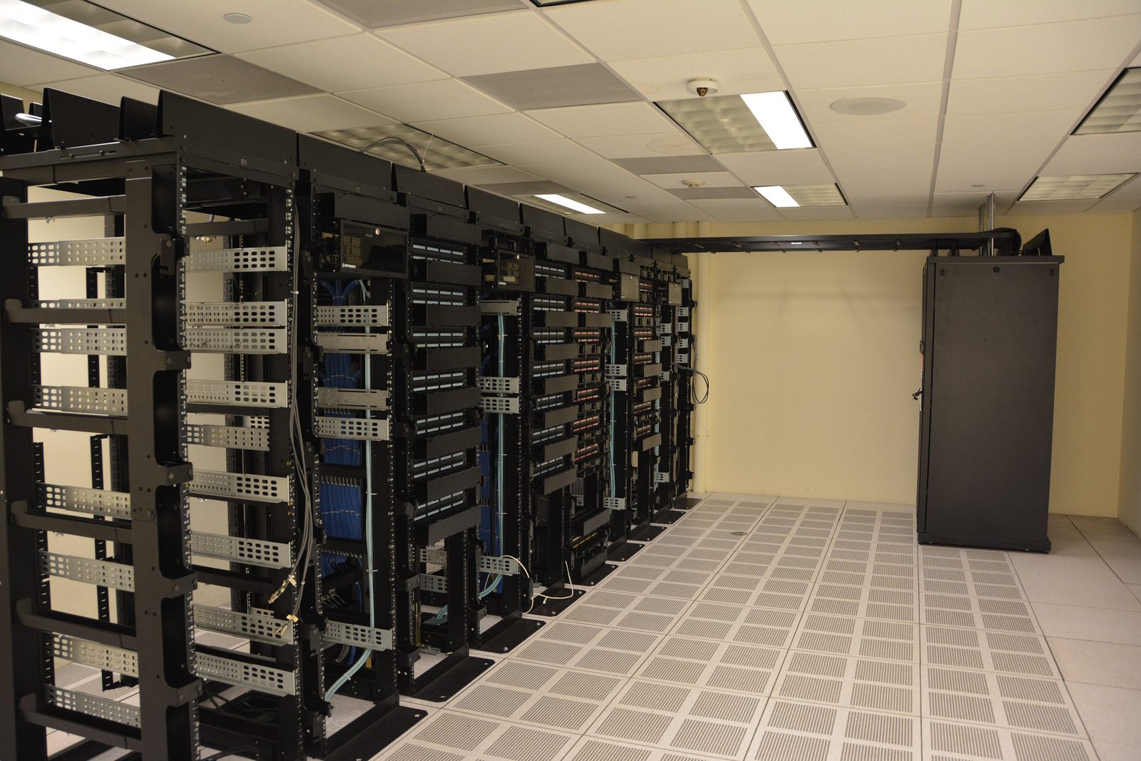 Rows of servers in a data center, the kind of internet-facing infrastructure targeted in the autonomous campaign.