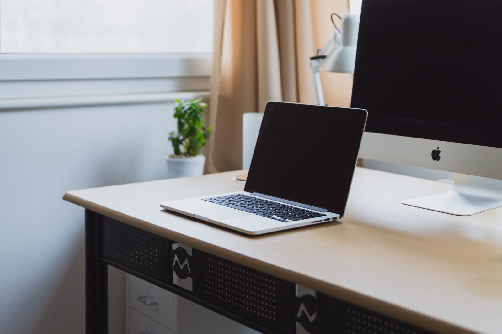 A laptop open on a desk.