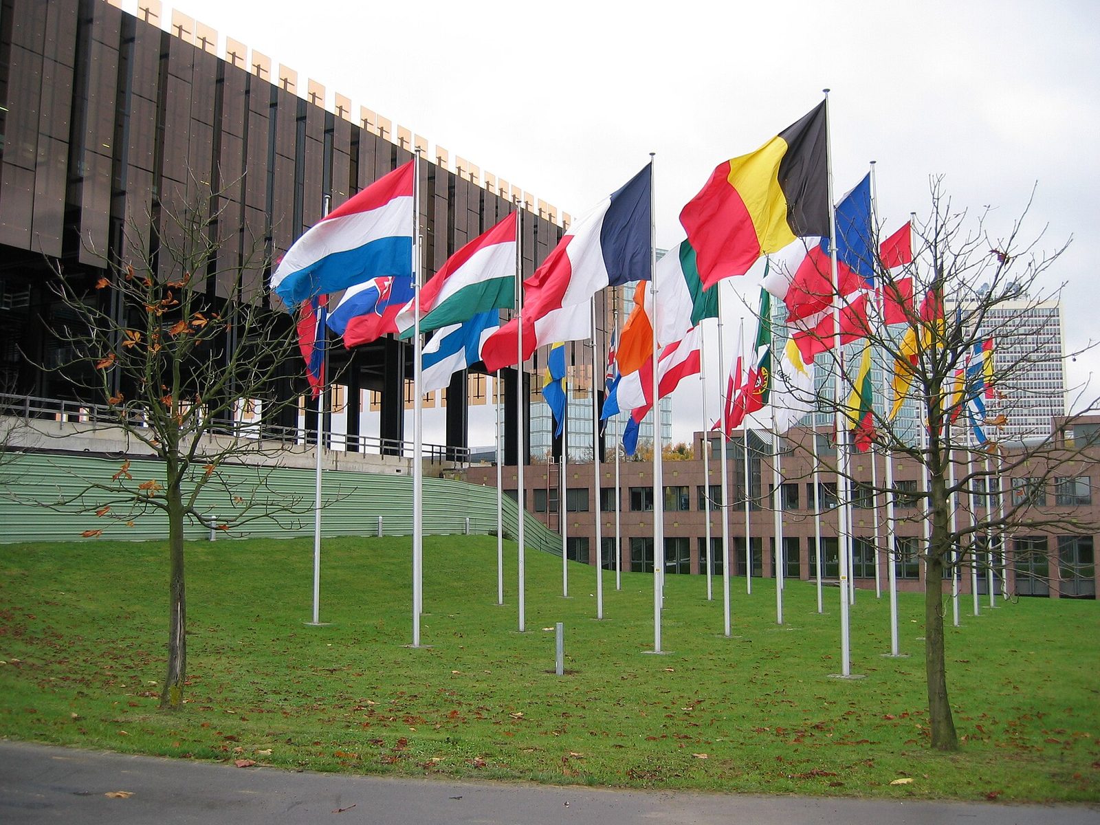 The Court of Justice of the European Union in Luxembourg, flags flying outside.
