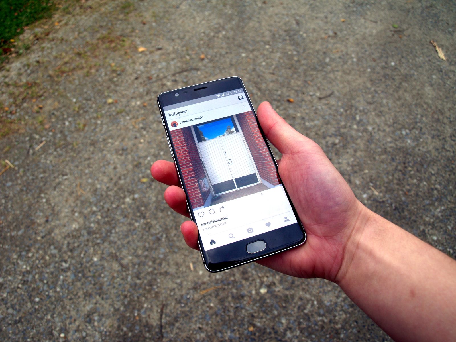 The Instagram app open on a smartphone held in one hand.