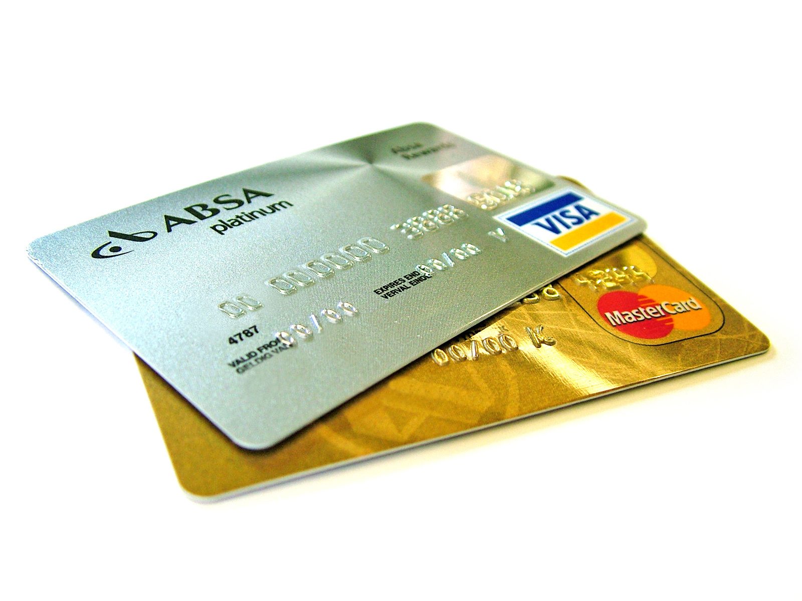 A stack of credit cards including a Visa card