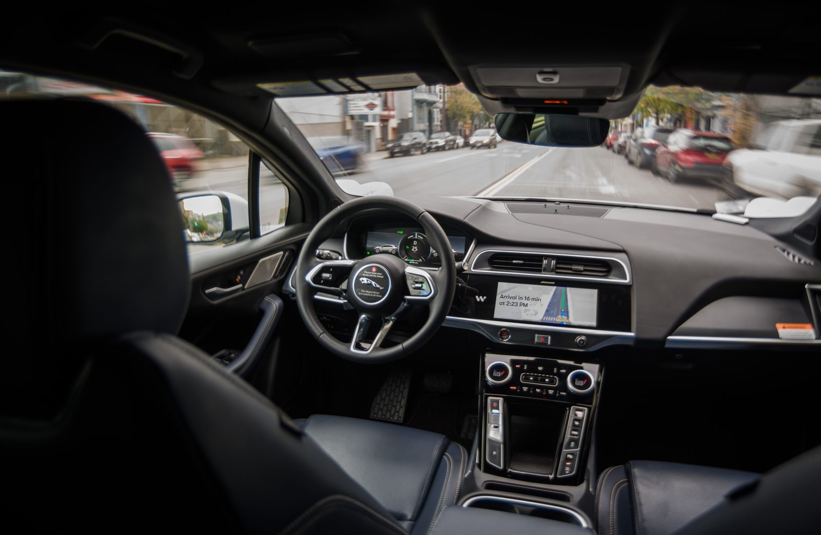 The interior of a driverless Waymo Jaguar I-Pace robotaxi in motion in San Francisco